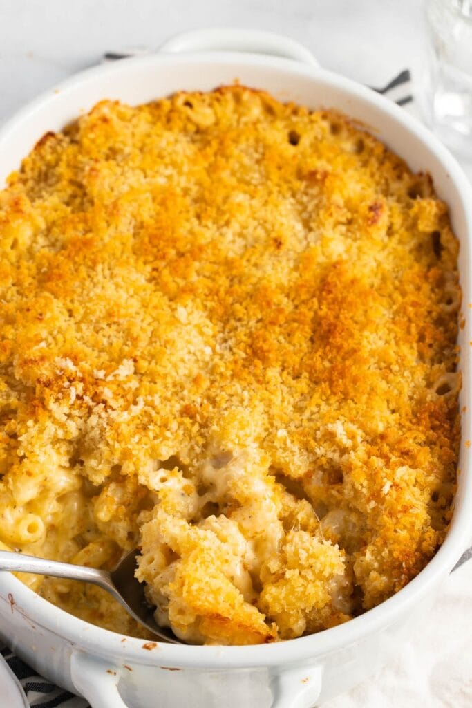Spoon Scooping Cheesy Ina Garten's Mac and Cheese From a Baking Dish