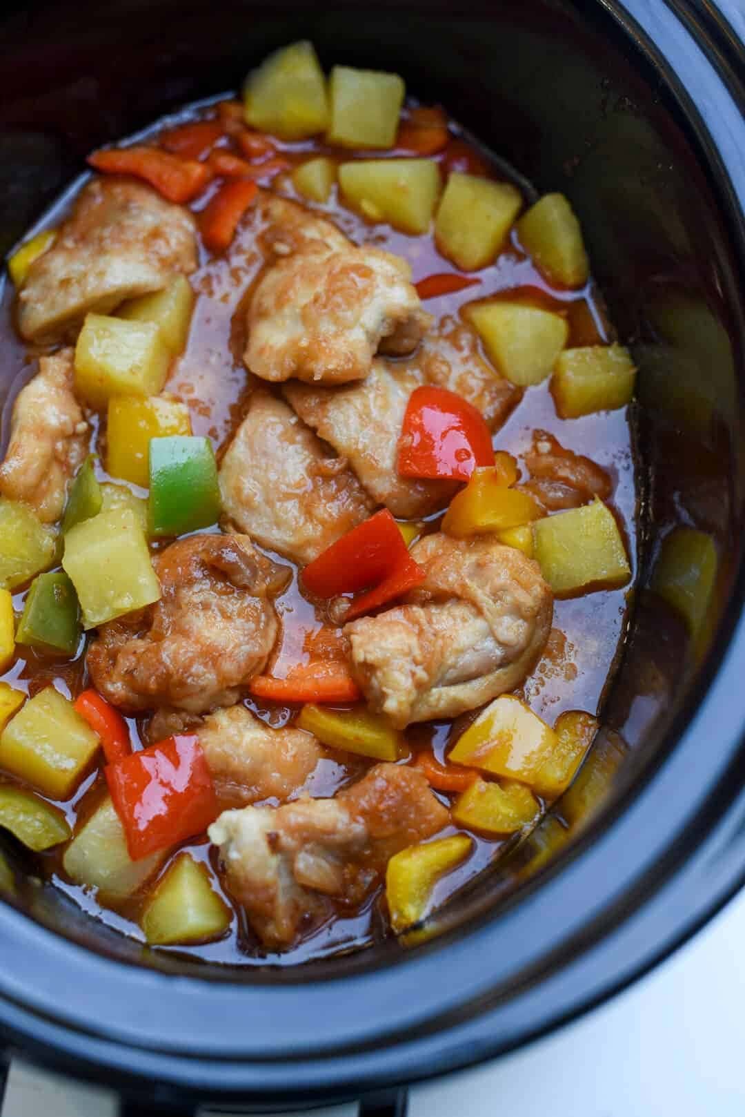 Slow Cooker Sweet and Sour Chicken with cubed bell peppers and pineapples 
